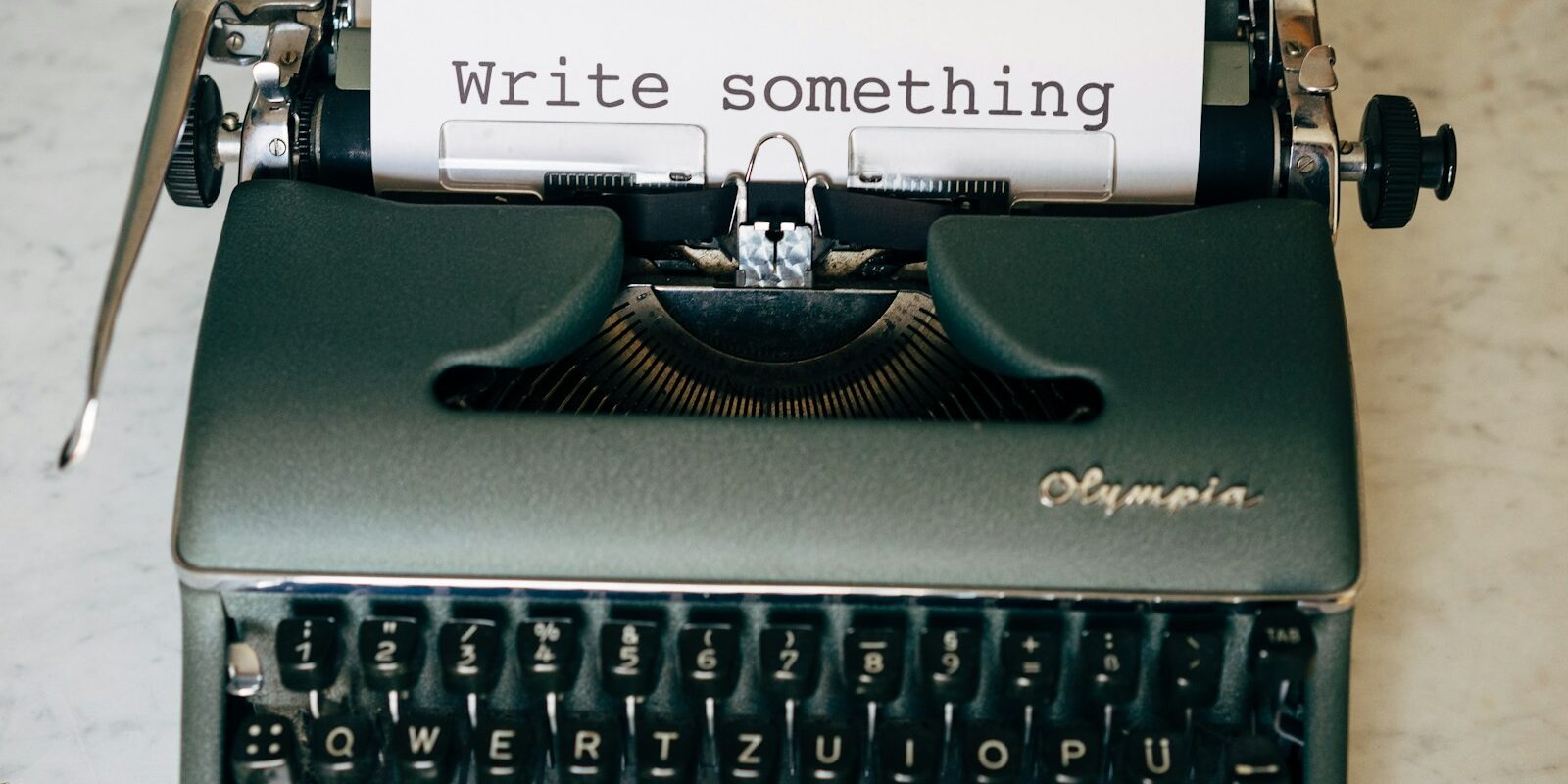 black and white typewriter on green table